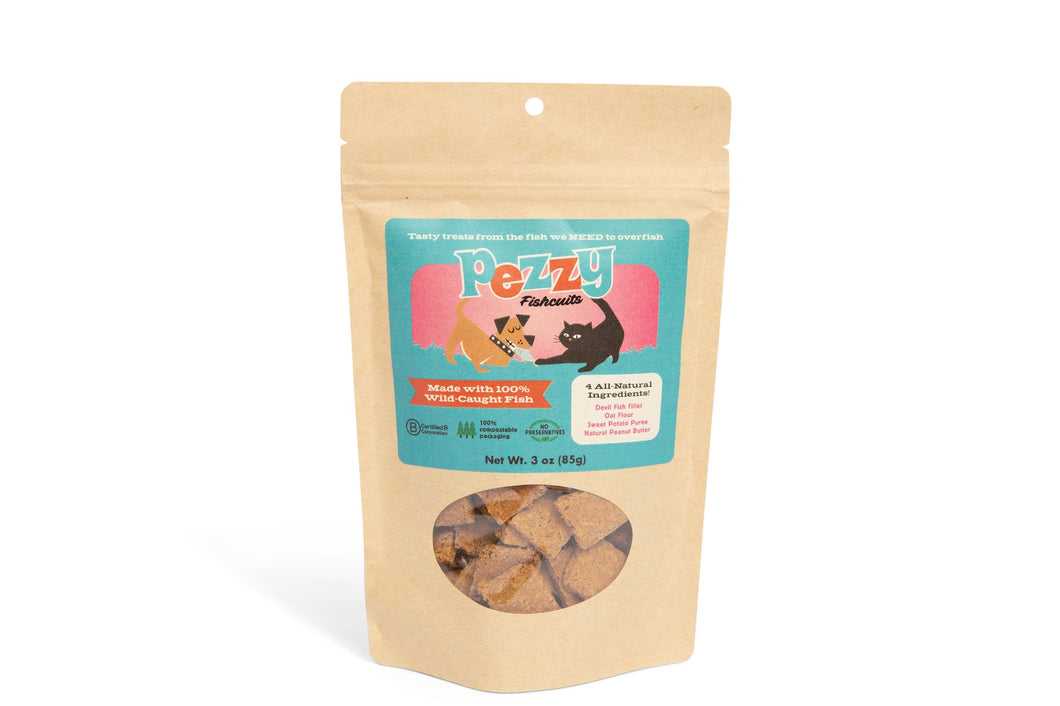 Three ounce bag of Pezzy Fishcuits. Front of packaging that includes Pezzy logo and transparent window displaying Fishcuits, which look like square cookies.